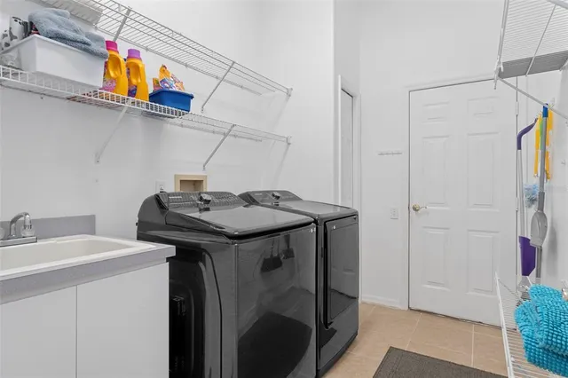 a utility room with dryer and washer
