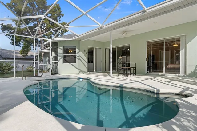 a view of a house with backyard porch and sitting area