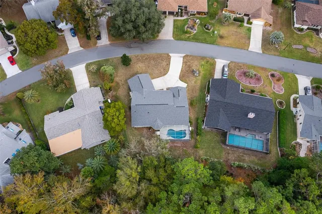 an aerial view of house with a yard