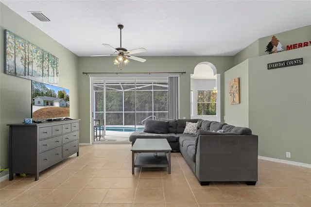 a living room with furniture and windows