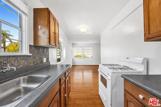 a view of a living room with a kitchen
