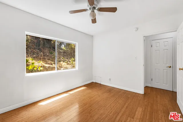 a bathroom with a sink mirror bathtub and toilet