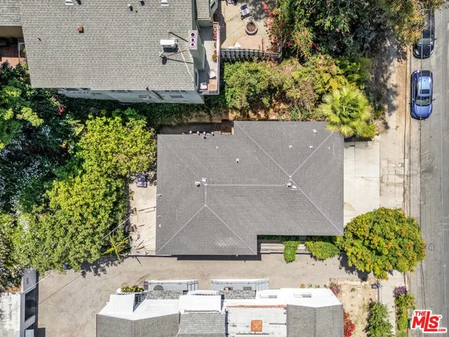 an aerial view of a house with a yard