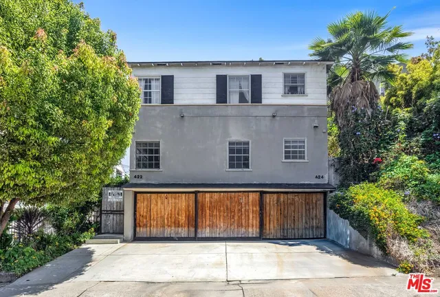 a house with trees in front of it