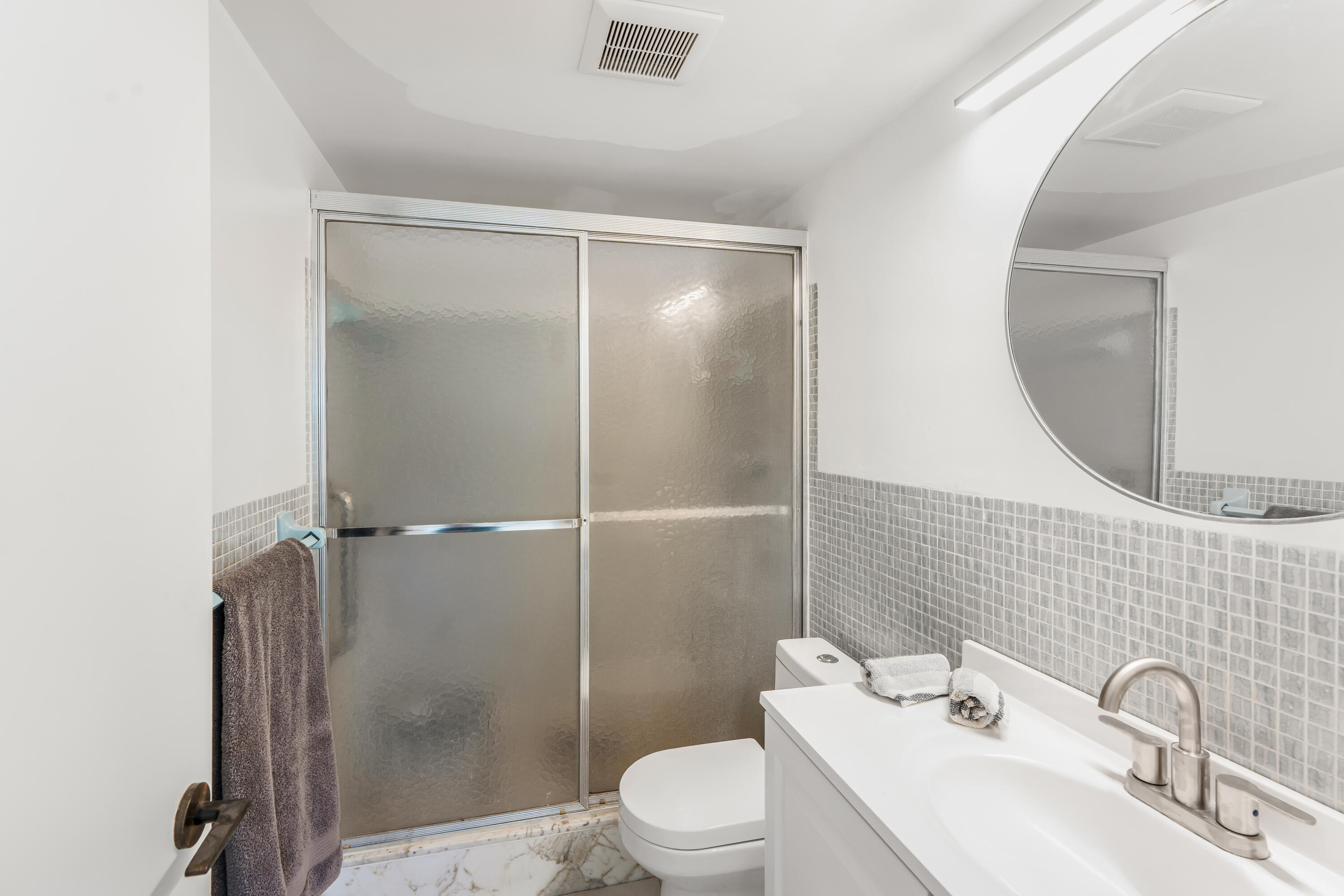 200 East Royal Palm Road, Unit 2030 Boca Raton, FL 33432 - Photo 11 of 20 a bathroom with a sink toilet and shower