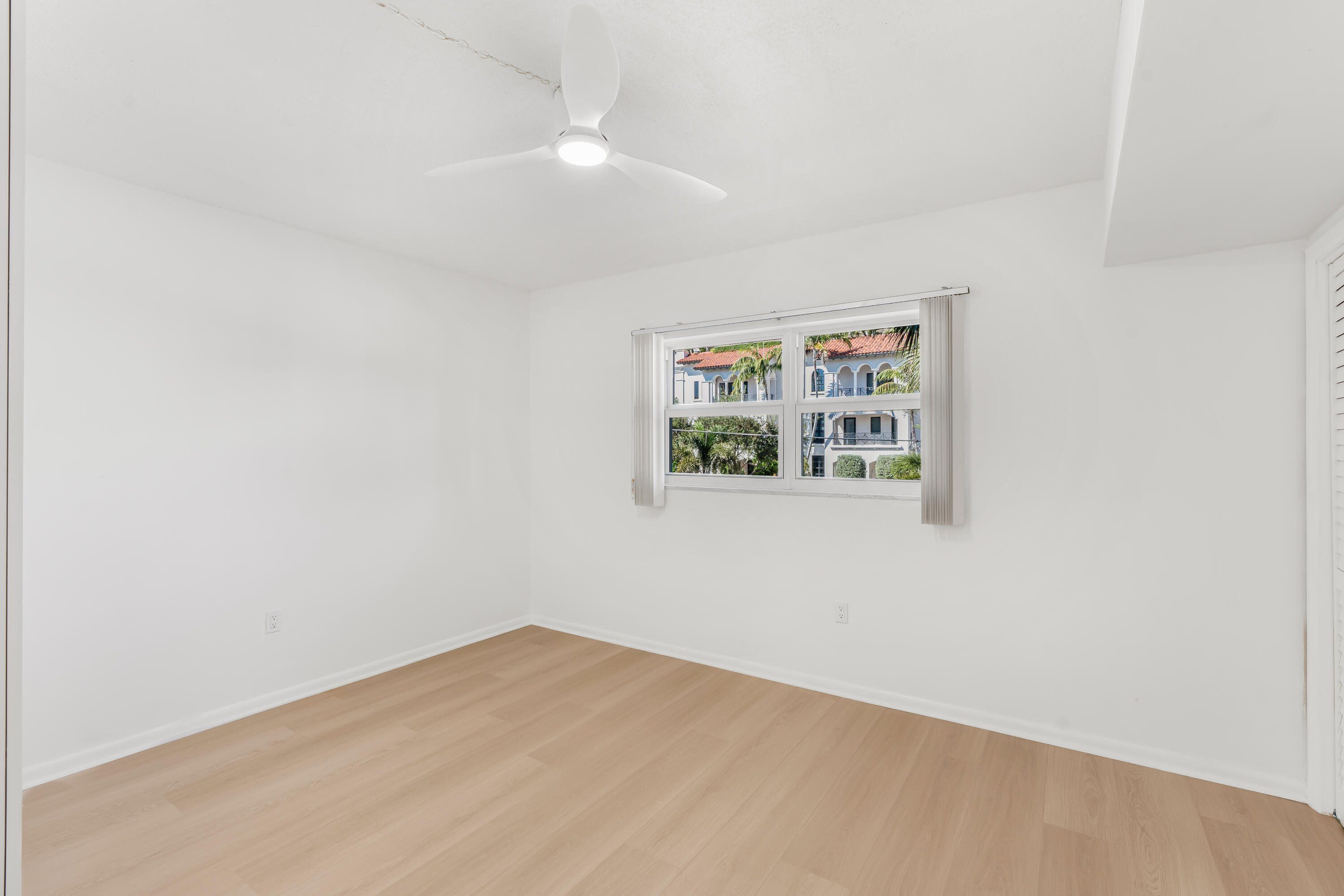 200 East Royal Palm Road, Unit 2030 Boca Raton, FL 33432 - Photo 14 of 20 an empty room with windows