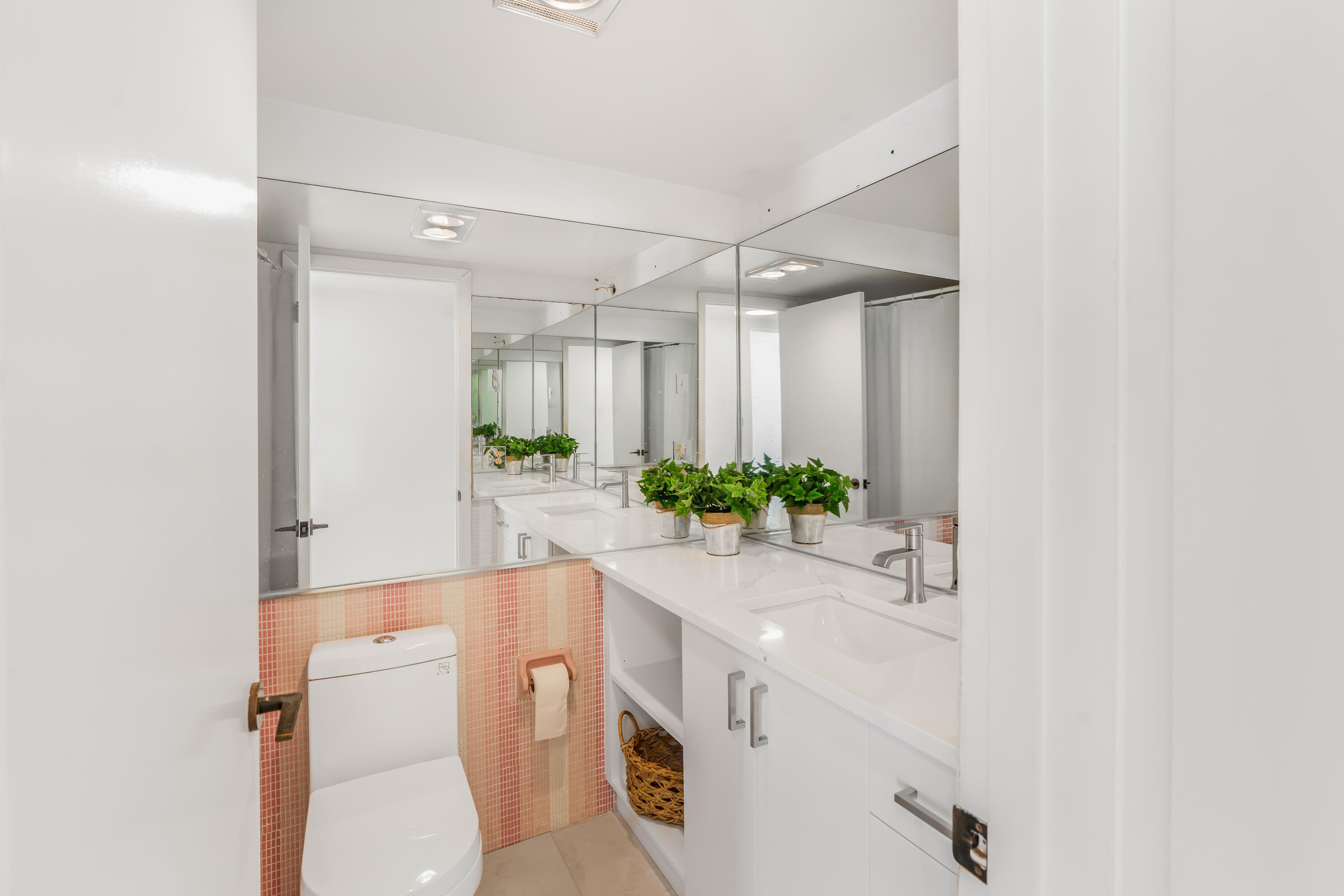 200 East Royal Palm Road, Unit 2030 Boca Raton, FL 33432 - Photo 16 of 20 a spacious bathroom with a double vanity sink and a mirror