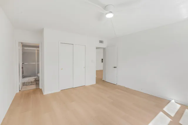 a view of an empty room with a bathroom