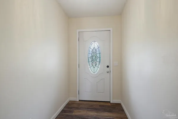 a view of a small space with wooden floor
