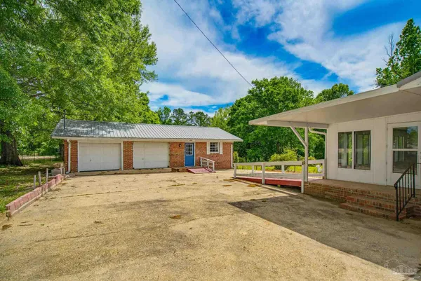 a house with trees in the background