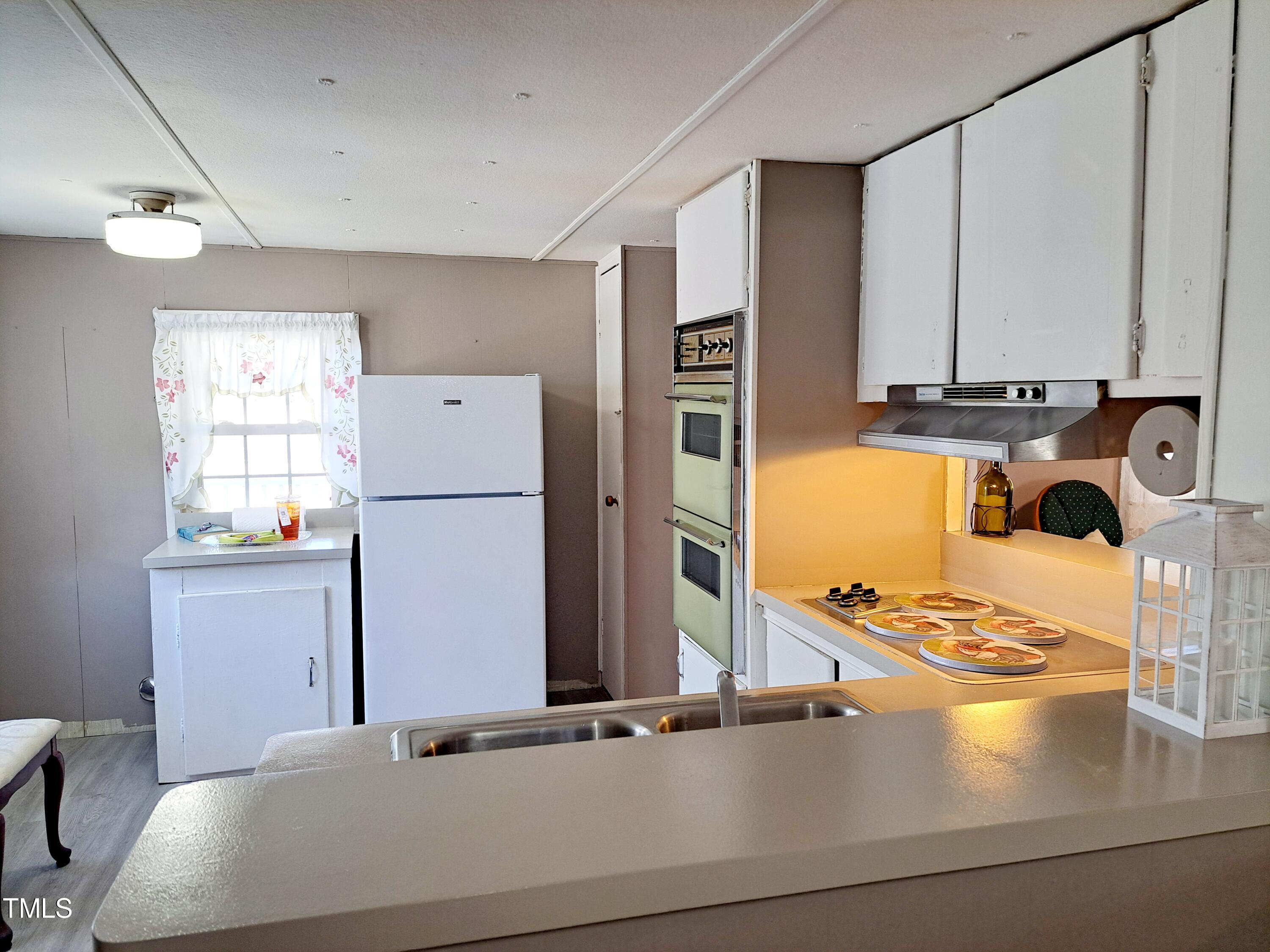 322 Owens Road Angier, NC 27501 - Photo 4 of 14 Cozy and cute Kitchen with wall oven