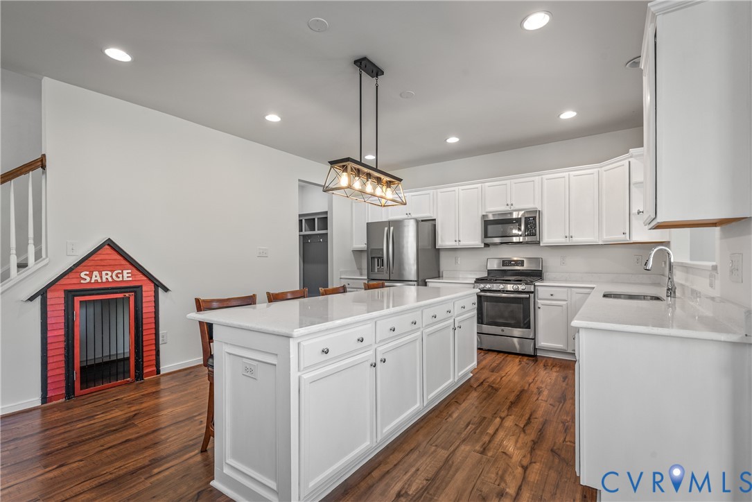 8200 Timberstone Drive Chesterfield, VA 23832 - Photo 13 of 42 a kitchen with stainless steel appliances granite countertop a sink stove and refrigerator