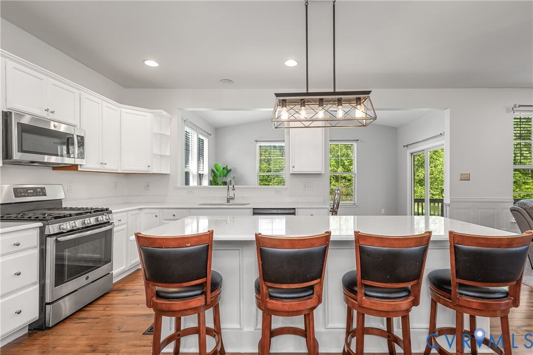 8200 Timberstone Drive Chesterfield, VA 23832 - Photo 14 of 42 a kitchen with a dining table and chairs