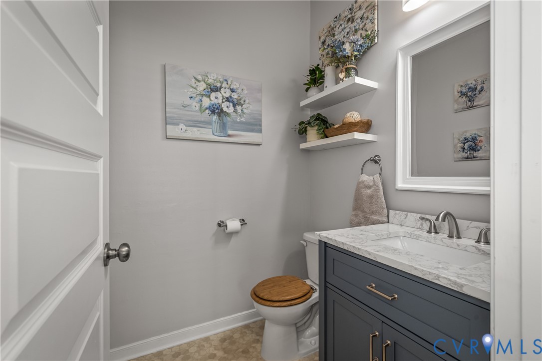 8200 Timberstone Drive Chesterfield, VA 23832 - Photo 24 of 42 a bathroom with a granite countertop toilet sink and mirror