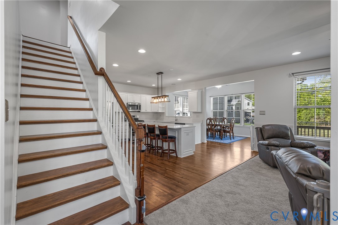 8200 Timberstone Drive Chesterfield, VA 23832 - Photo 25 of 42 a living room with furniture and a dining table with wooden floor