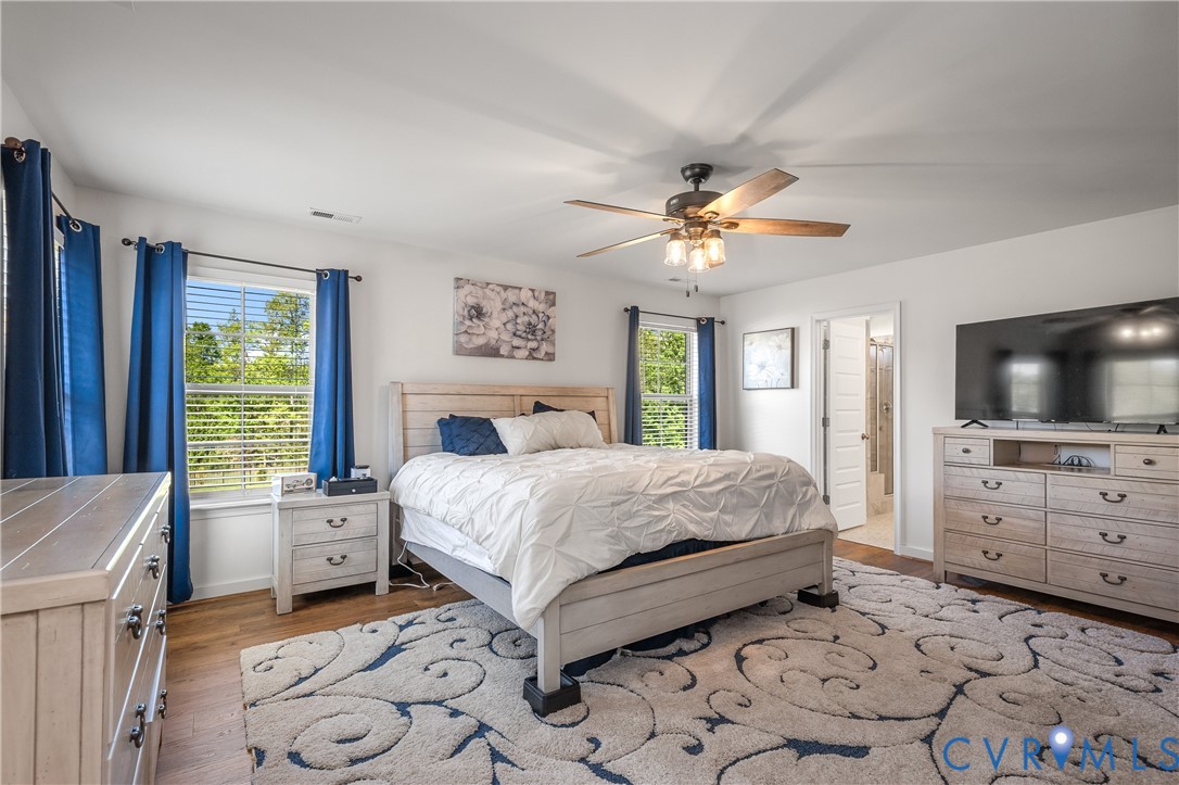 8200 Timberstone Drive Chesterfield, VA 23832 - Photo 28 of 42 a bedroom with a bed and a flat screen tv in it