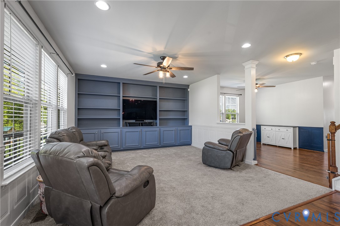 8200 Timberstone Drive Chesterfield, VA 23832 - Photo 9 of 42 a living room with furniture and a flat screen tv