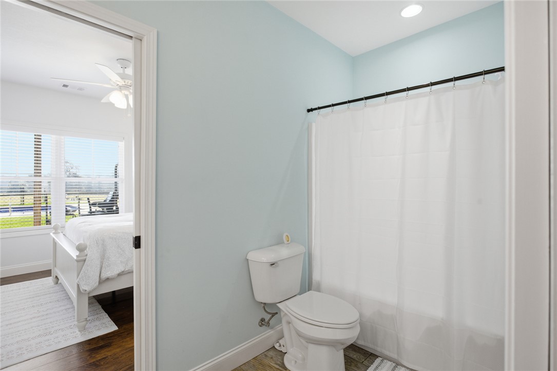 426 Oak Creek Road Seneca, SC 29678 - Photo 25 of 50 A well-appointed bathroom offers a convenient escape adjacent to a bright bedroom.