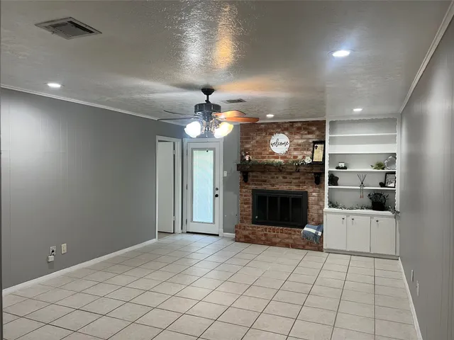 a view of a kitchen with furniture and a fireplace