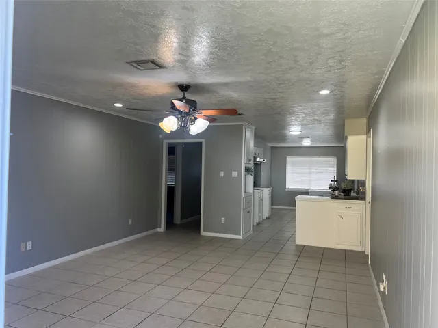 a bathroom with a shower curtain and sink
