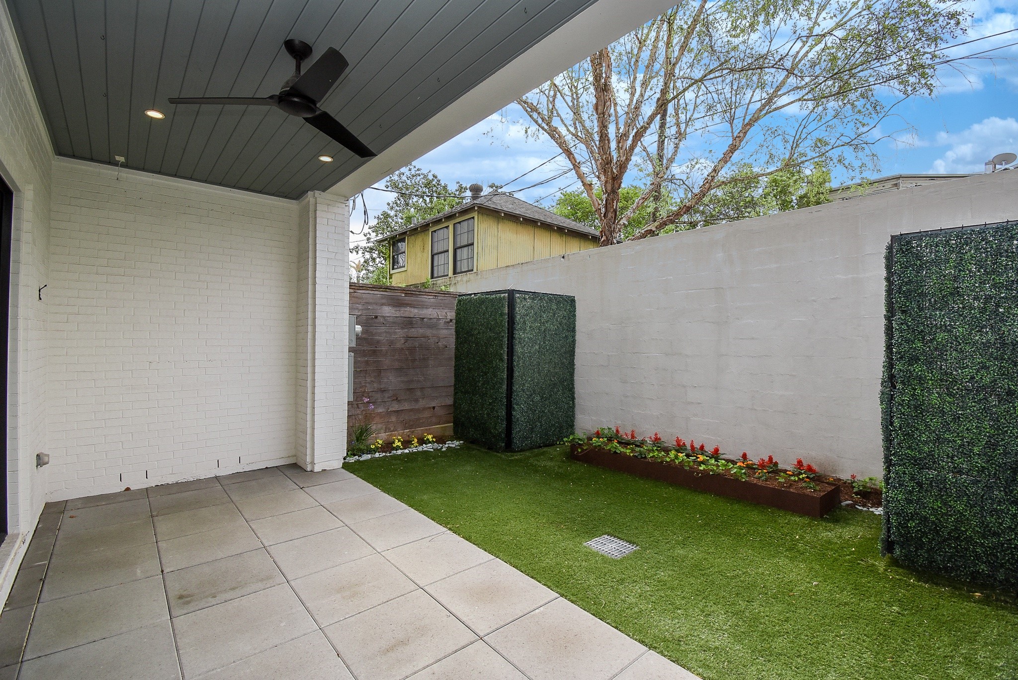 1107 Berthea Street, Unit B Houston, TX 77006 - Photo 12 of 50 a view of backyard with trampoline