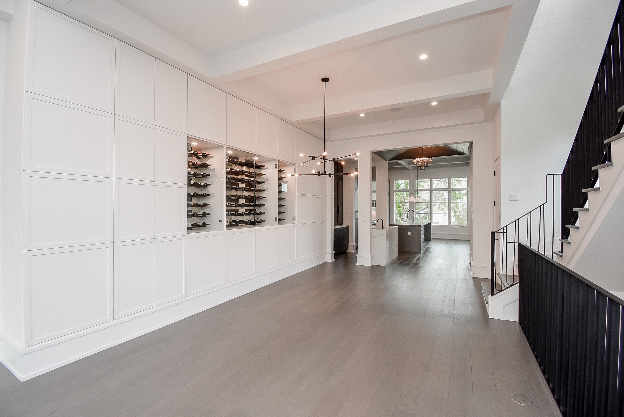 1107 Berthea Street, Unit B Houston, TX 77006 - Photo 18 of 50 a view of a hallway with wooden floor and a kitchen