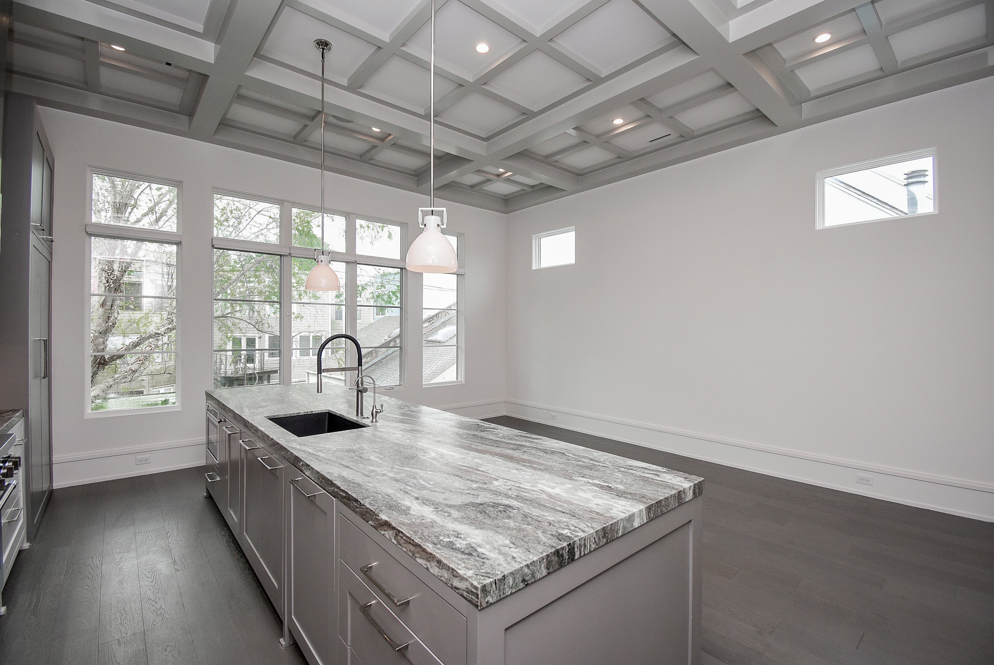 1107 Berthea Street, Unit B Houston, TX 77006 - Photo 26 of 50 a kitchen with granite countertop a sink a stove and a granite counter top