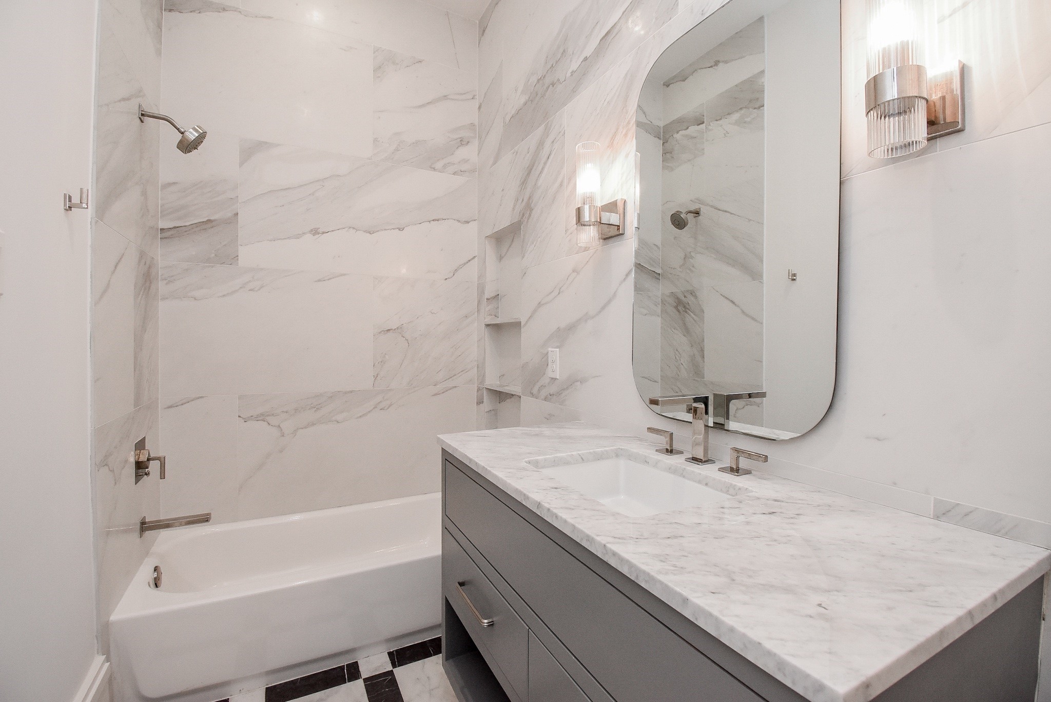 1107 Berthea Street, Unit B Houston, TX 77006 - Photo 42 of 50 a bathroom with a granite countertop sink a mirror and a bathtub