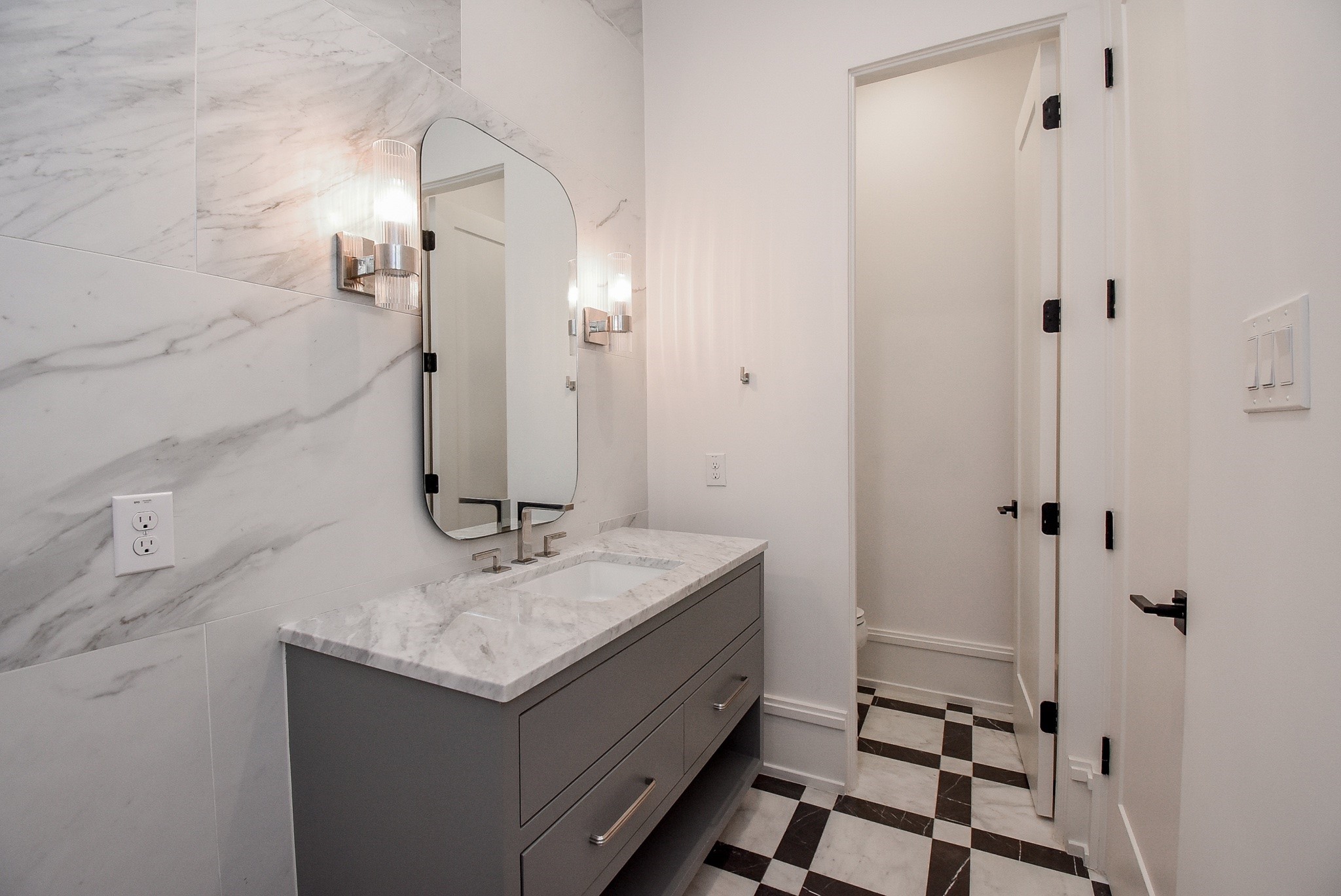1107 Berthea Street, Unit B Houston, TX 77006 - Photo 43 of 50 a bathroom with a sink and a mirror
