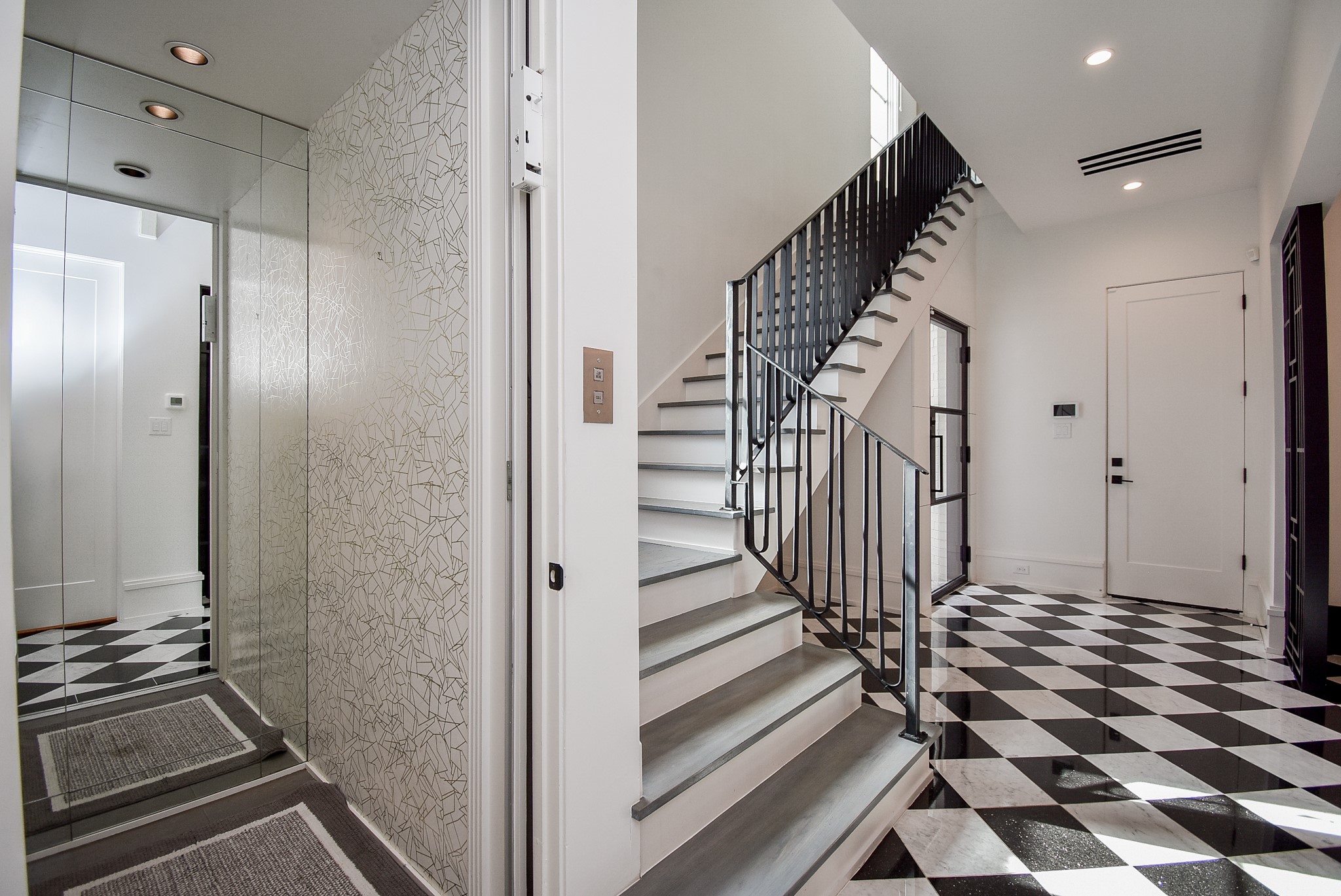 1107 Berthea Street, Unit B Houston, TX 77006 - Photo 6 of 50 a view of a hallway with wooden floor and staircase
