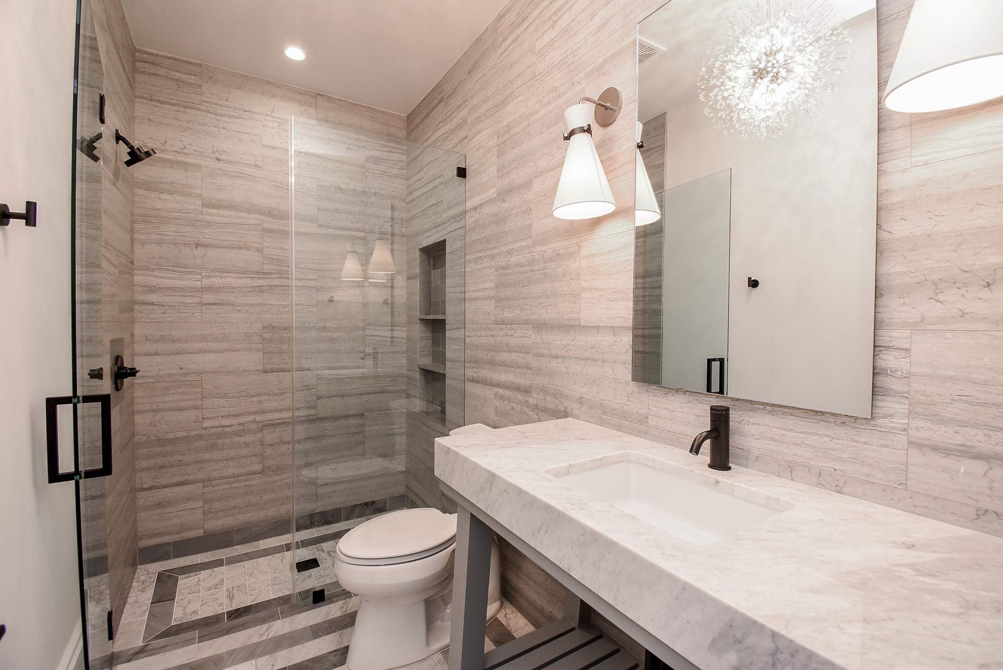 1107 Berthea Street, Unit B Houston, TX 77006 - Photo 7 of 50 a bathroom with a sink a toilet and shower