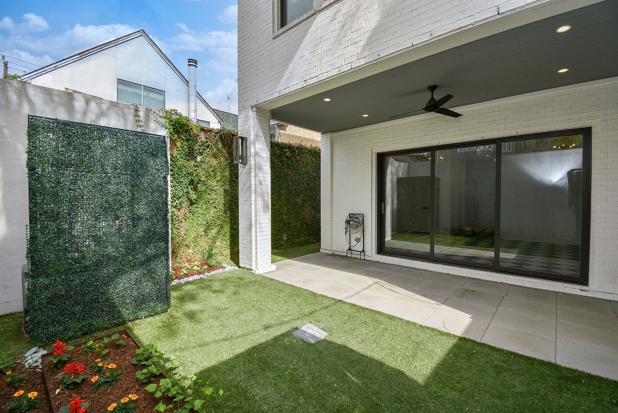 1107 Berthea Street, Unit B Houston, TX 77006 - Photo 10 of 50 a porch with seating space and garden view