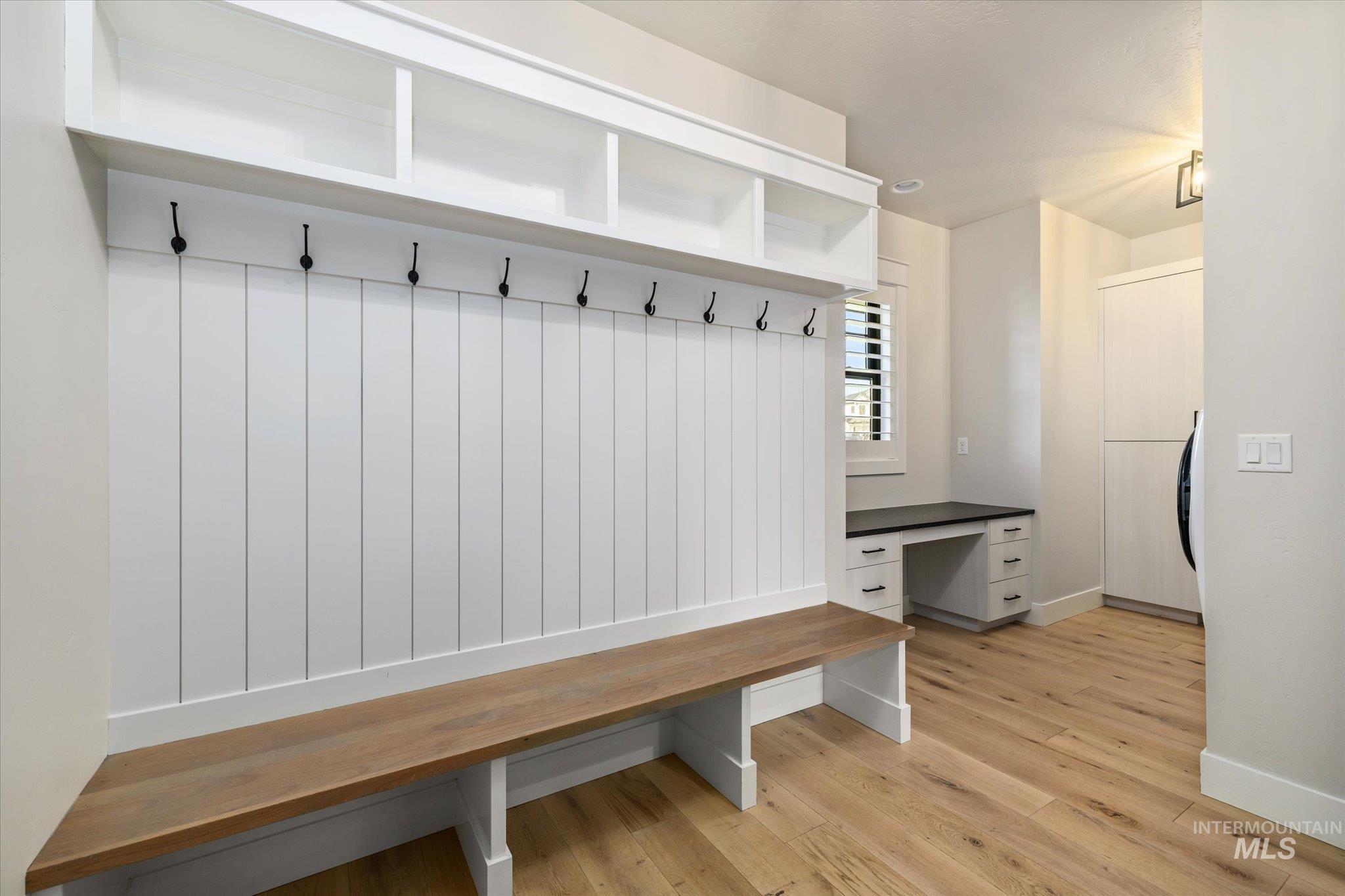 14857 Elk Spg Street Caldwell, ID 83607 - Photo 29 of 40 Mudroom with light wood-style floors and built in desk