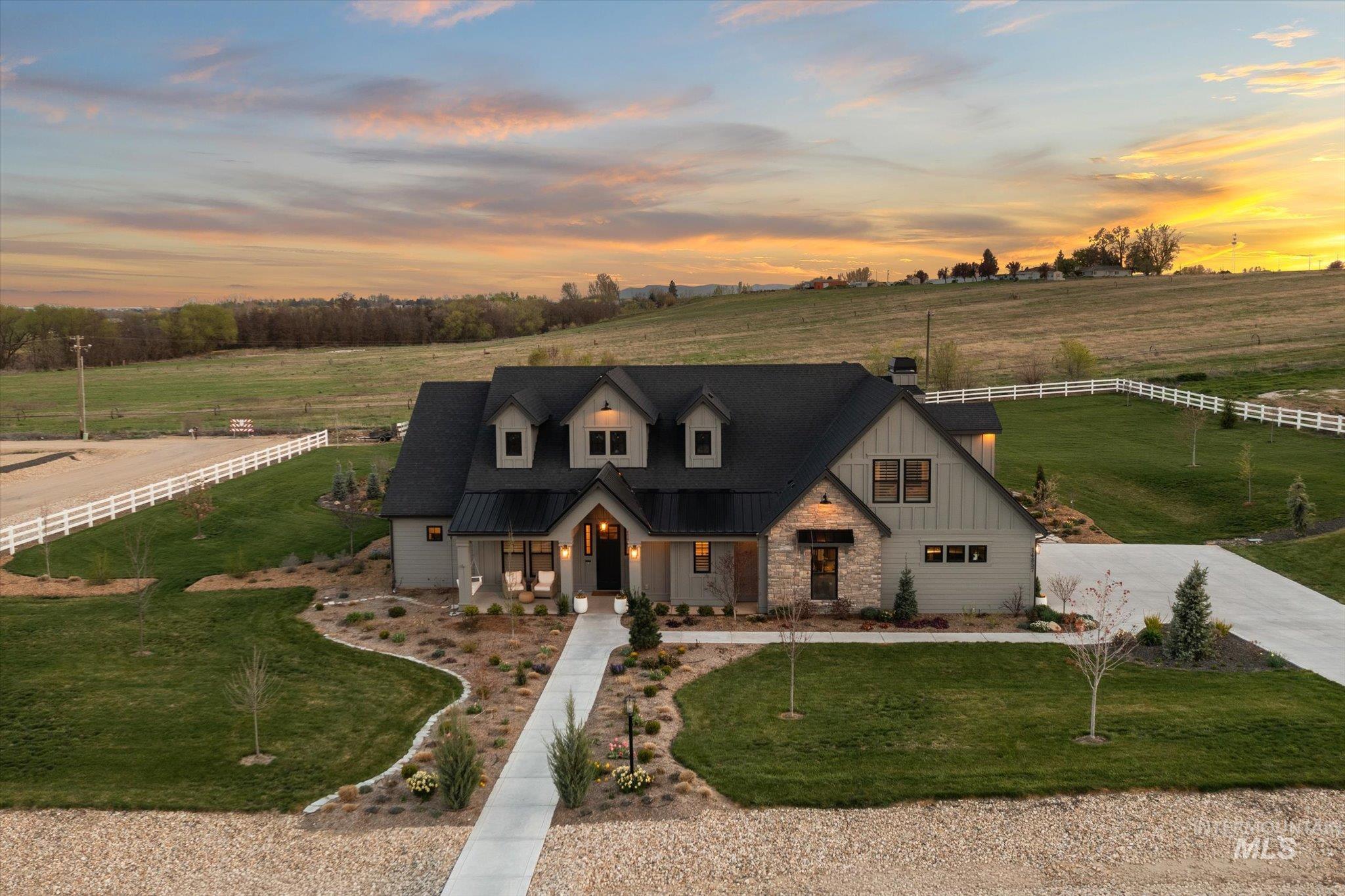 14857 Elk Spg Street Caldwell, ID 83607 - Photo 35 of 40 Modern inspired farmhouse with a porch, stone siding, a rural view, and concrete driveway
