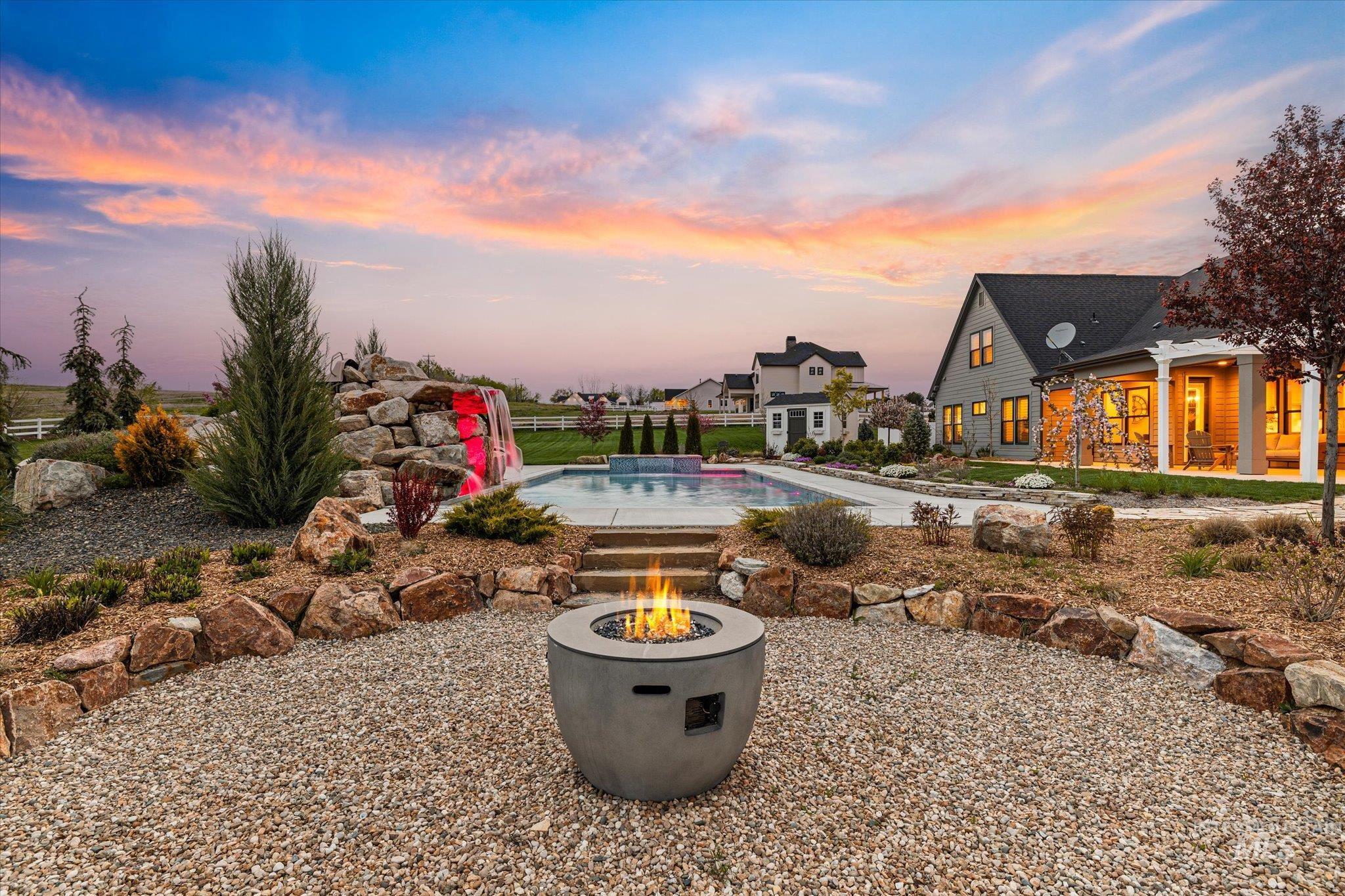 14857 Elk Spg Street Caldwell, ID 83607 - Photo 4 of 40 Outdoor pool with a patio area and an outdoor fire pit