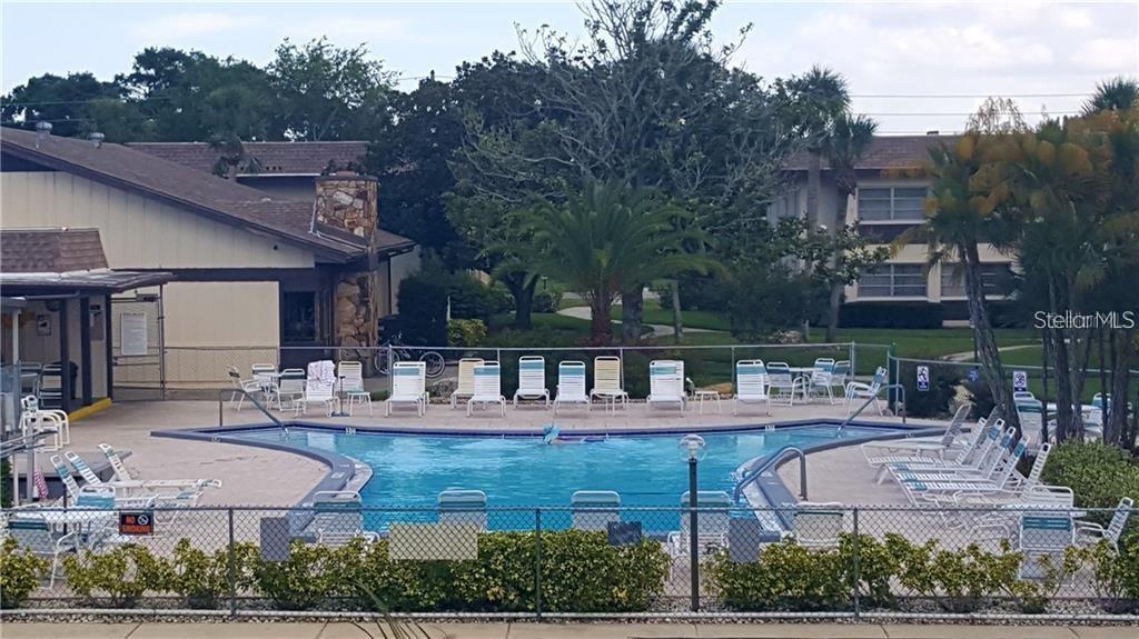 4758 Jasper Drive, Unit 206 New Port Richey, FL 34652 - Photo 13 of 34 an aerial view of a house with swimming pool and outdoor seating