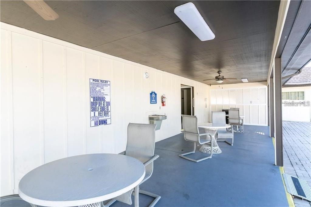 4758 Jasper Drive, Unit 206 New Port Richey, FL 34652 - Photo 16 of 34 a view of a dining room with furniture and wooden floor