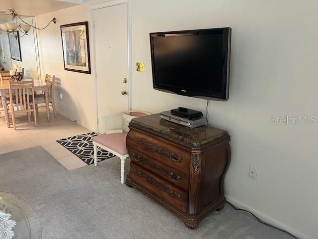 4758 Jasper Drive, Unit 206 New Port Richey, FL 34652 - Photo 3 of 34 a living room with furniture and a flat screen tv