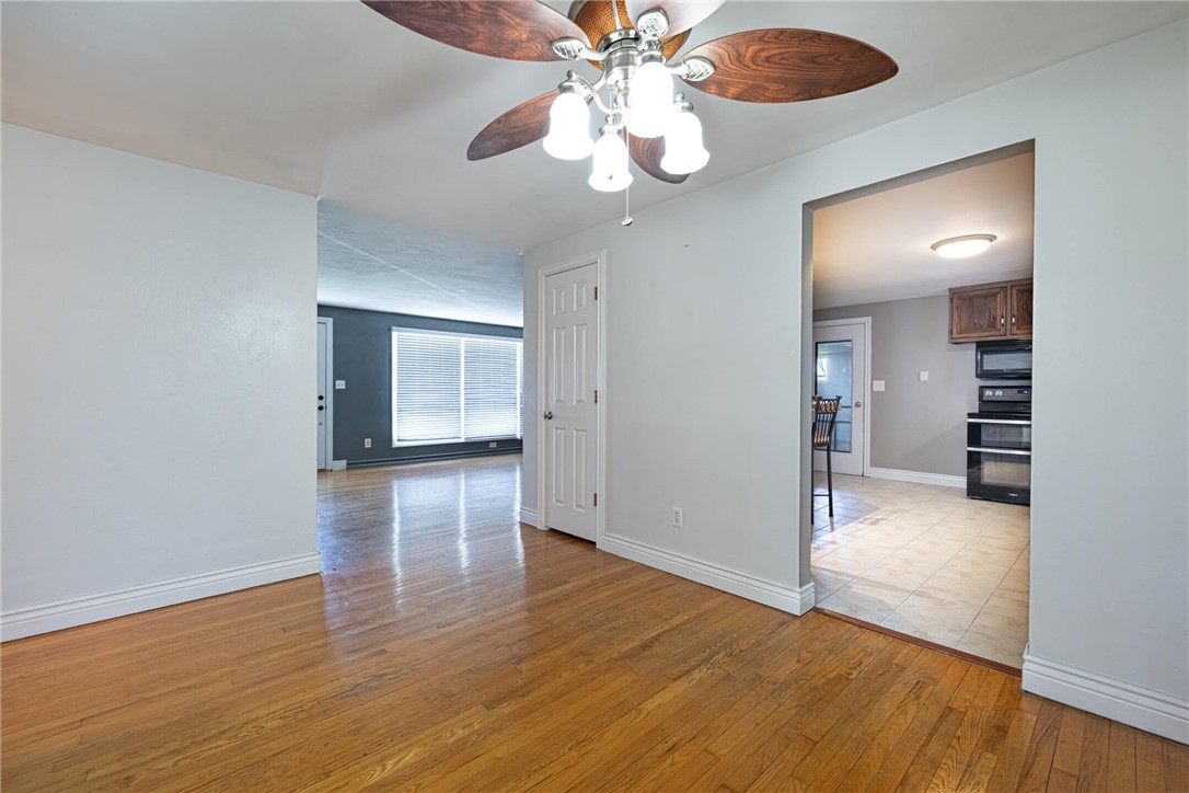 5235 West Ridgewood Road Springfield, OH 45503 - Photo 6 of 32 This interior features rich hardwood flooring and a stylish ceiling fan.