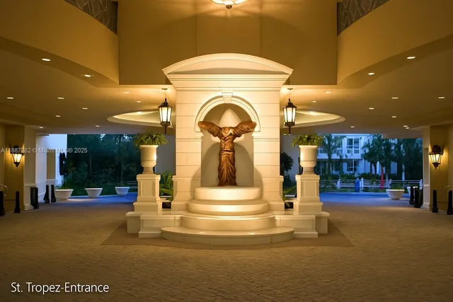 a view of a lake with a large barn