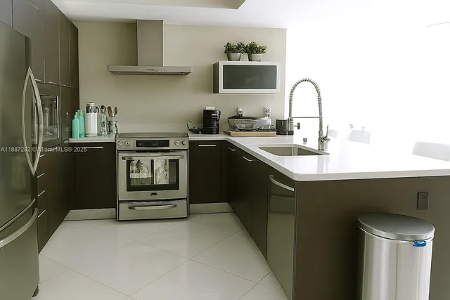 a kitchen with a sink appliances and cabinets