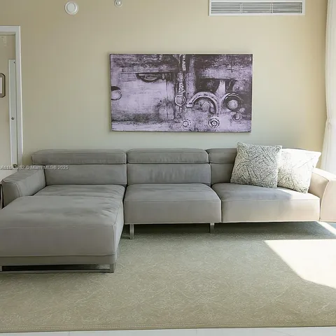 a living room with furniture and a couch