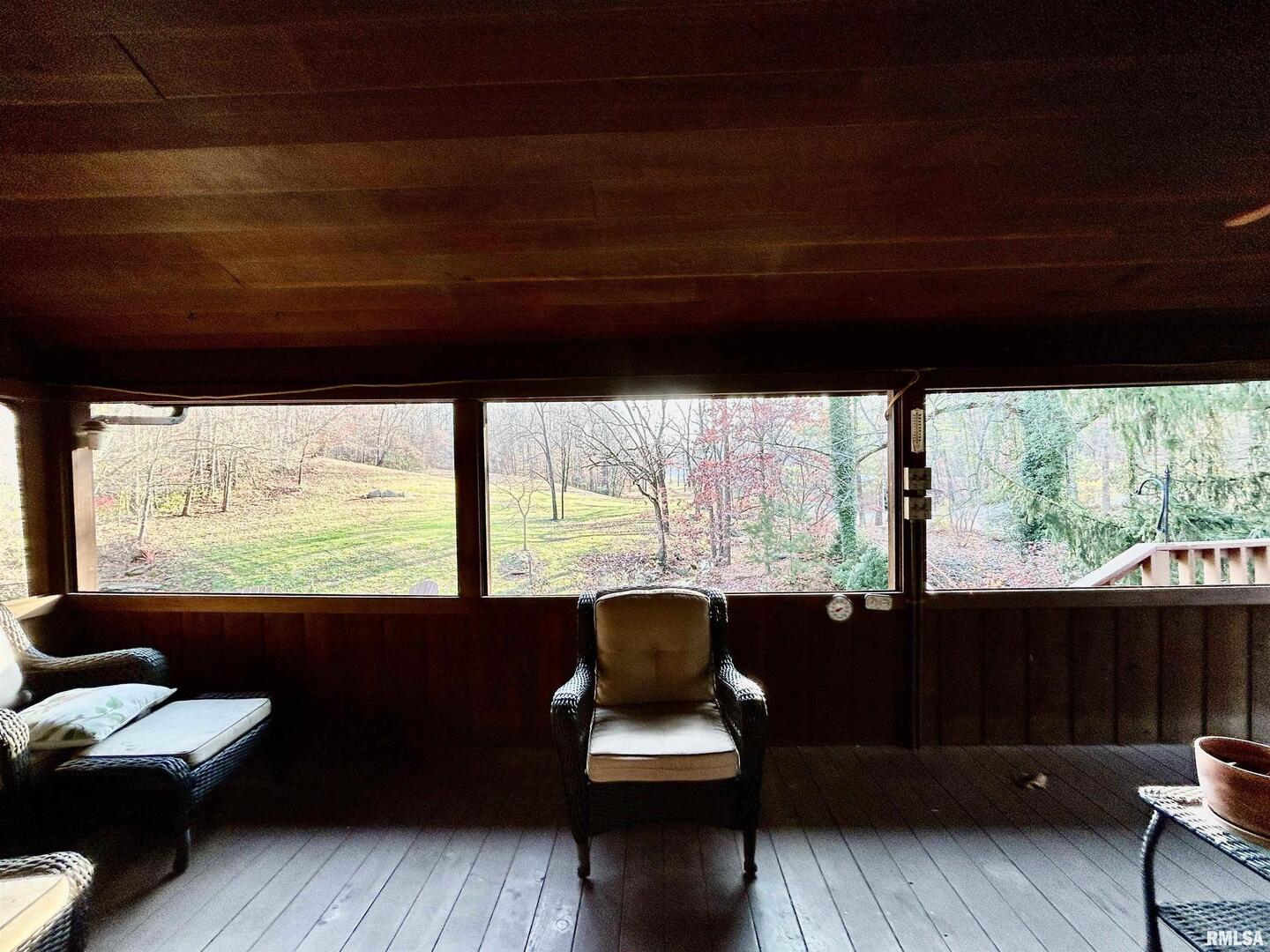 61 Schack Murphysboro, IL 62966 - Photo 13 of 43 a living room with large windows and a table