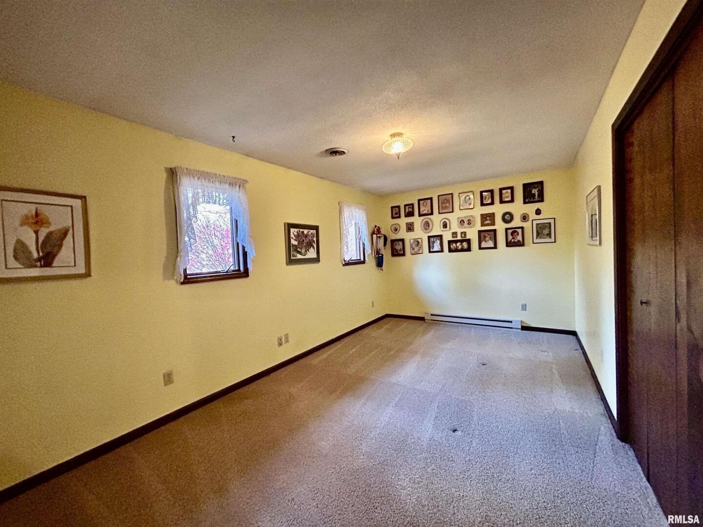 61 Schack Murphysboro, IL 62966 - Photo 16 of 43 a view of a big room with wooden floor and windows