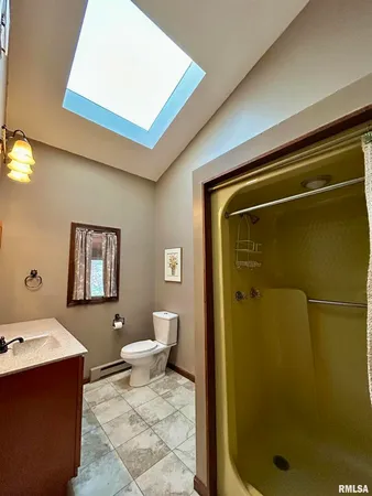a bathroom with a tub and shower