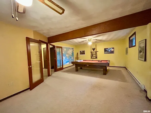 a bedroom with bed and window