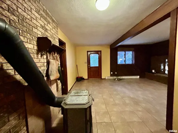 a view of a livingroom with furniture and staircase