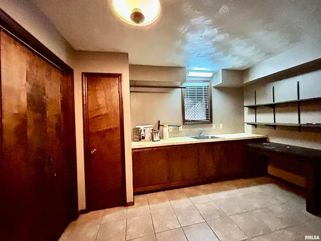 a large bathroom with a large tub and shower