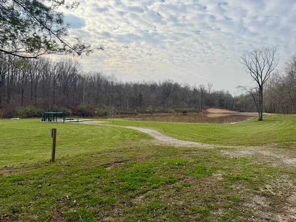 a view of outdoor space with deck and yard