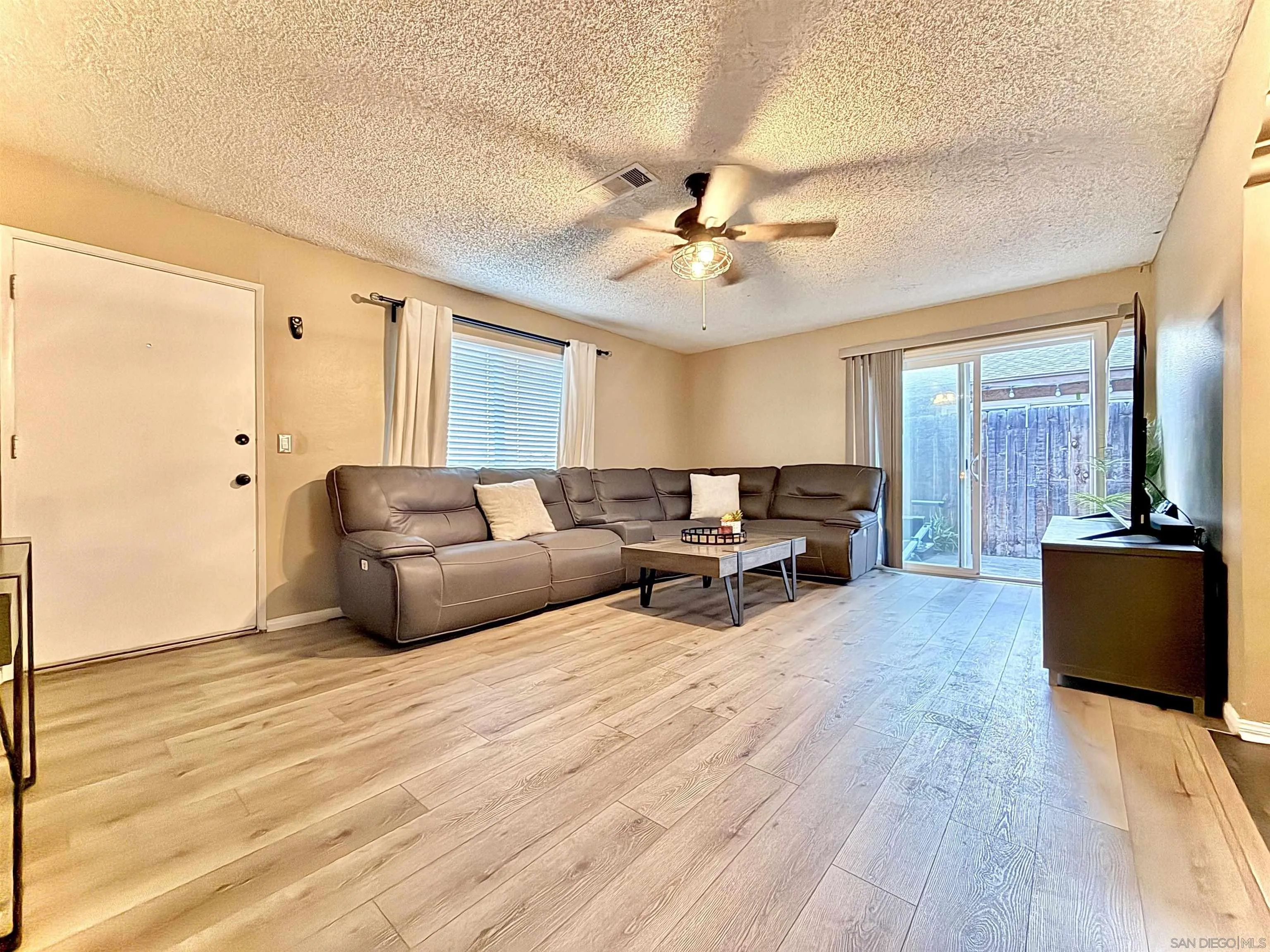 321 Sun Court El Cajon, CA 92021 - Photo 11 of 33 a living room with furniture and wooden floor